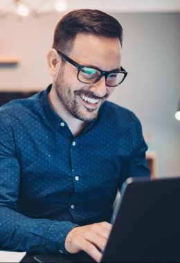 Businessman using laptop at home